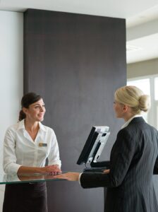Washingtonian Concierge front desk team using modern building management technology